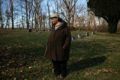 Janis Ivory in the cemetery where her parents are buried in Rendville, OH where she grew up. Janis, her brother Harry and others are working to revitalize the old coal town.